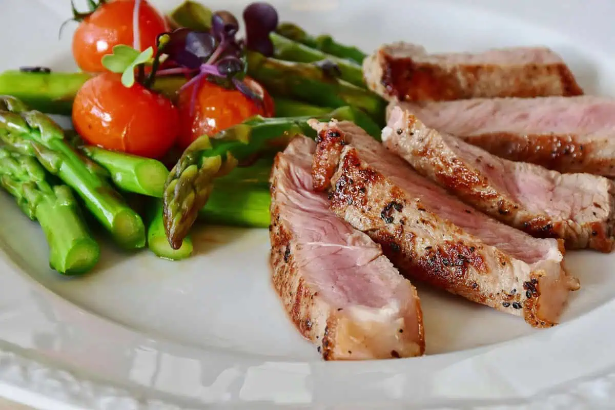 Harvested and cooked asparagus with steak